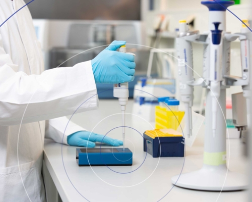 Close-up of laboratory technician checking a pipette with ATMOS